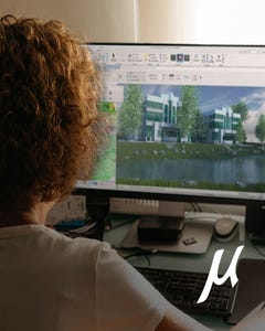 Woman working at her computer on a CAD drawing